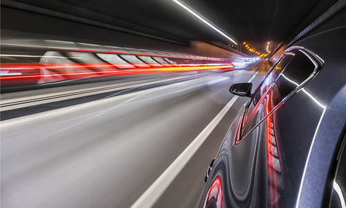 Image of a car and tunnel and lights